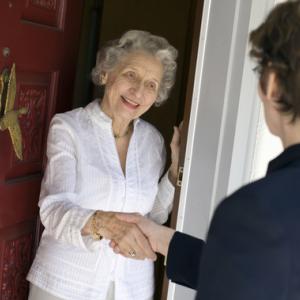 Door-to-door solicitor photo, EdBockStock / Shutterstock.com