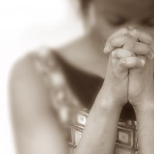 Praying woman, EML / Shutterstock.com