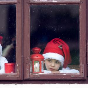 Two boys wait for Santa. Image courtesy Tomsickova Tatyana/shutterstock.com