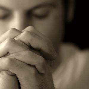 Man Praying, Kevin Carden/Shutterstock.com