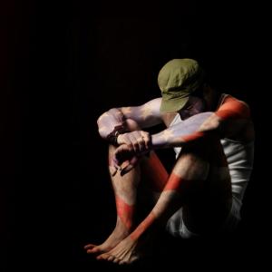 Solider in isolation painted with an American flag. Image courtesy CURAphotograp