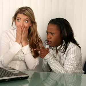 Women outraged looking at a computer screen, VanHart / Shutterstock.com