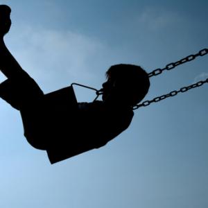 Child swinging, Ana de Sousa / Shutterstock.com