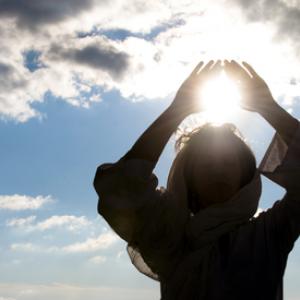 Young woman meditating, Luna Vandoorne / Shutterstock.com