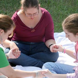 Photo: Group prayer circle, Lisa F. Young/ Shutterstock.com