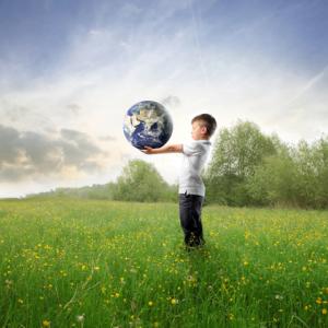 Child holding the earth, olly, Shutterstock.com
