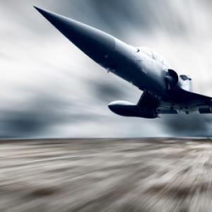 Military plane, Andrey Yurlov/ Shutterstock.com