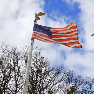 American flag and church steeple, Bobkeenan Photography / Shutterstock.com