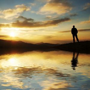 Silhouette of man in front of sunset, Galyna Andrushko / Shutterstock.com