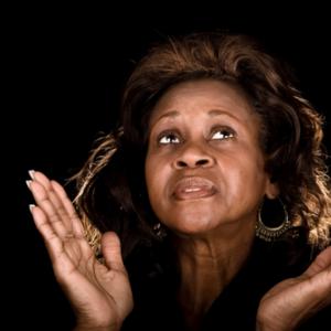 Photo: Woman praying, © John Wollwerth  / Shutterstock.com