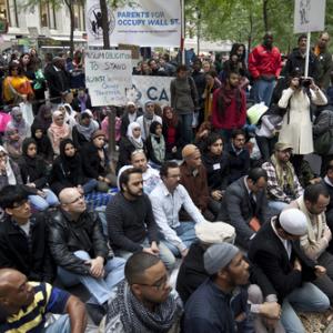 Imam leads muslims in a sermon at Occupy Wall Street by Lev Radin/Shutterstock.