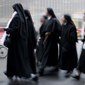 Group of a nuns walking, SVLuma/Shutterstock.com