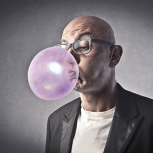 Man blowing bubbles photo, olly / Shutterstock.com