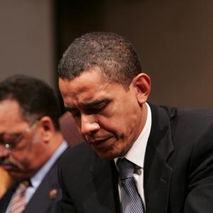 Obama in prayer. Image courtesy Stephen C./shutterstock.com