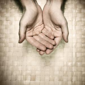 Offering hands, Antonov Roman/ Shutterstock.com