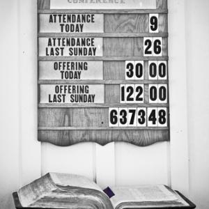 Church attendance board, SUSAN LEGGETT / Shutterstock.com