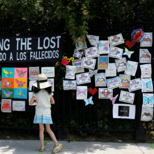 A child looks at the “Naming the Lost Memorials” at The Green-Wood Cemetery in Brooklyn, N.Y., on June 10, 2021. REUTERS/Brendan McDermid.