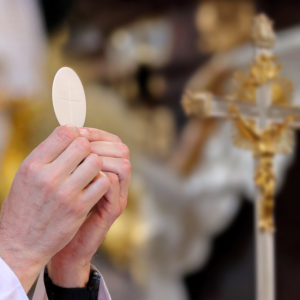 Priest celebrates mass at the church and empty place for text