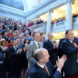 Utah Gov. Gary Herbert displays Senate Bill 296 after signing it into state law.