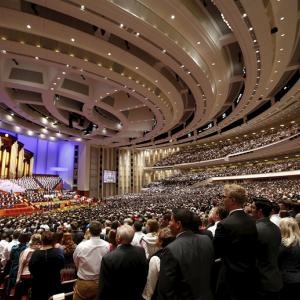 The Mormon Tabernacle Choir and conference goers sing in Salt Lake City, April 4