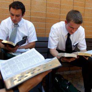 Two students study mormon scriptures at the Missionary Training Center. Photo co