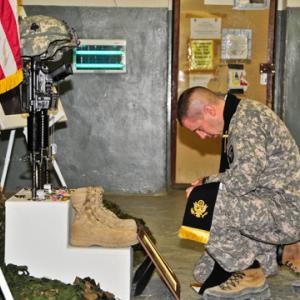 Army Chaplain Capt. Joseph Odell mourns a fallen soldie. RNS photo via Odell.