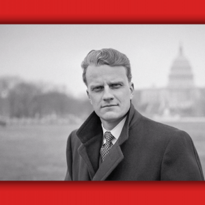 Billy Graham looks straight into the camera with the US Capitol building behind him.