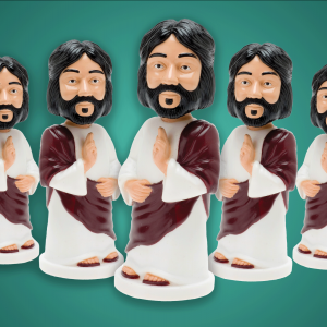 The image shows a group of plastic bobble-head Jesuses