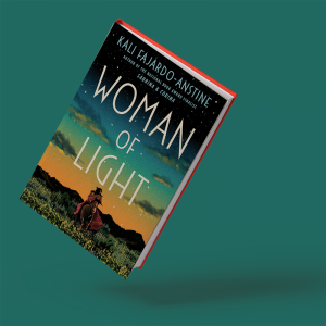 The book 'Woman of Light' is tilted at a 15-degree angle on a dark green background. The cover depicts a woman standing on the plains with mountains and a sunset behind her