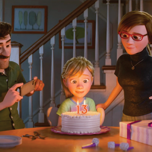 Image of Inside Out 2 where Riley is sitting in front of a birthday cake with her parents by her side.