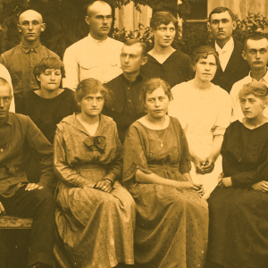A photo taken in 1923 of the Mennonite church choir in Osterwick, Ukraine. There are 14 people in the photo, both men and women.
