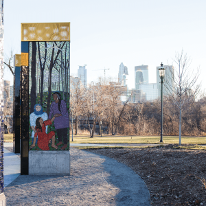 A Memorial to Survivors of Sexual Violence in Minneapolis. The murals are done with mosaics of blue, silver, brown and red colors.