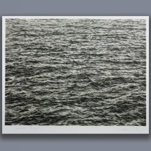 A black-and-white lithograph of rippling ocean waves, meticulously drawn by Vija Celmins so as to appear like a black-and-white photo.