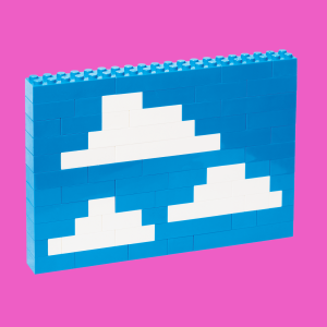 Legos built together to look like clouds in a blue sky.