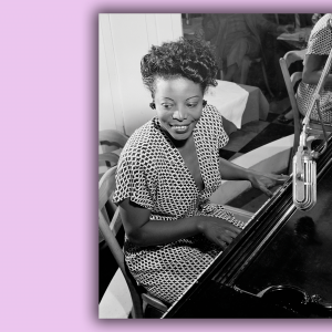 A portrait of Mary Lou Williams playing the piano and smiling.