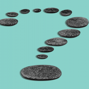 Illustration of round, flat stones in the shape of a question mark