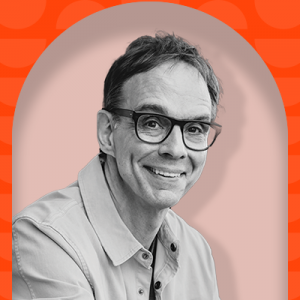 A black-and-white headshot of a white man with large glasses, short hair, and collared shirt overlaid on a light pink outline on top of a dark red background with slightly lighter red half-moon shapes.