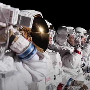 A row of people in astronaut suits