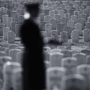 An Army honor guard holds a flag during a funeral ceremony at Arlington National Cemetery in Virginia.