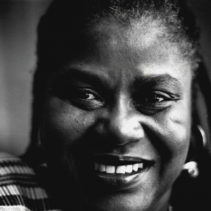 Black and white photo of Bernice Johnson Reagon smiling into the camera.