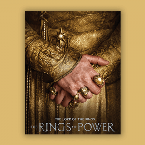 The cover of "The Rings of Power" showing two hands folded over adorned with many golden rings. 