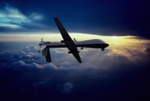 MQ-1 Predator Unmanned Drone with Hellfire Missiles Flying at Sunset. Erik Simonsen / Getty Images Erik Simonsen / Getty Images