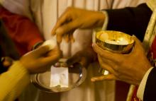 Christian woman receives communion wafers in Kashmir, India. Photo by Yawar Nazir/Getty Images Photo by Yawar Nazir/Getty Images