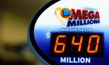 A sign displays the $640 Mega Millions jackpot at Liquorland on March 30 in California. Photo by Kevork Djansezian/Getty Images Photo by Kevork Djansezian/Getty Images