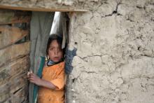 An Afghan girl looks out from the entrance of her mud hut at a refugee camp in Kabul. BAY ISMOYO/AFP/GettyImages BAY ISMOYO/AFP/GettyImages