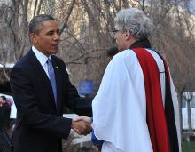 President Barack Obama is greeted by Rev. Luis Leon as he arrives at St. John's Church. NICHOLAS KAMM/AFP/Getty Images NICHOLAS KAMM/AFP/Getty Images