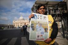 A man sells newspapers outside St Peter's Square on Thursday morning. Dan Kitwood/Getty Images Dan Kitwood/Getty Images