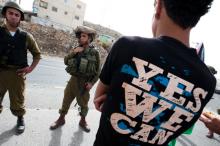 A Palestinian youth confronts Israeli soldiers at a nonviolent demonstration. Photo ryanrodrickbeiler.com Photo courtesy Ryan Roderick Beiler, ryanrodrickbeiler.com