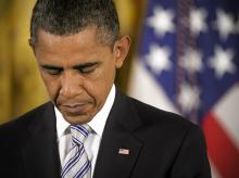 President Obama prays during a Medal of Honor ceremony, 9/15/11. Photo by Bill O'Leary/The Washington Post via Getty Images Photo by Bill O'Leary/The Washington Post via Getty Images