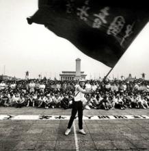 A man waves a flag in May 1989 at China’s Tiananmen Square. Creative Commons image by Robert Croma